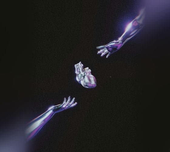 Two hands reaching toward each other